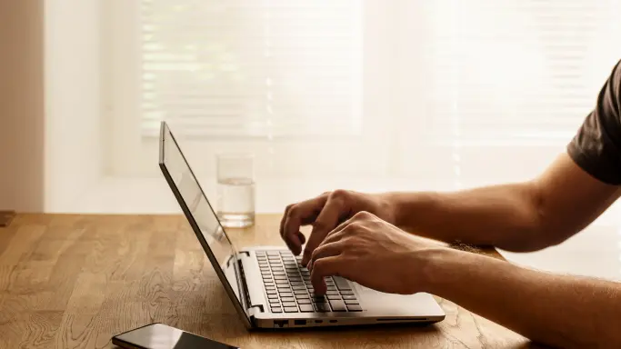 Instructor working on a laptop